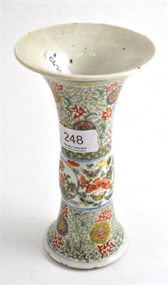 Lot 248 - A 19th century Chinese porcelain trumpet vase decorated in famille verte enamels with flowers...