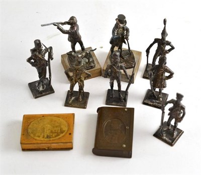 Lot 253 - A set of six silver miniature figures of British soldiers, two others 'The Squire & 'The Shot'...