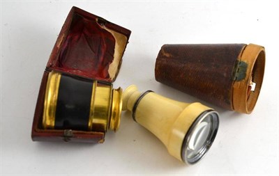 Lot 261 - An ivory mounted monocle and another, ebonised, both in leather cases (a.f.)