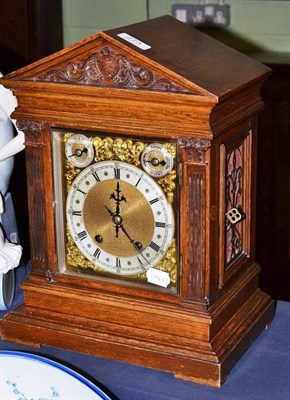 Lot 273 - A German oak table clock, movement stamped W&H for Winterhalder and Hofmeier and key