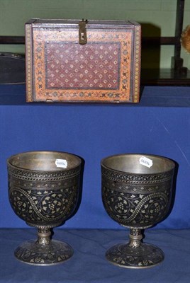 Lot 278 - Indian table cabinet with painted decoration and a pair of large metal goblets