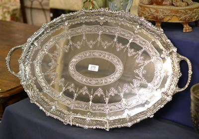 Lot 279 - A silver plated twin handled tray with engraved decoration