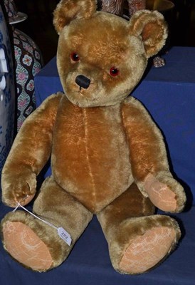 Lot 282 - A circa 1950's English jointed Teddy bear 'Norman', with blond plush, growler, stitched nose...