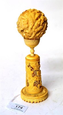 Lot 174 - A Chinese Carved Export Ivory Crocodile Ball on Stand, Canton, circa 1900, the 5.5cm diameter...