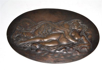 Lot 290 - An oval bronze plaque depicting an amorous couple
