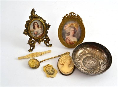 Lot 291 - A miniature on ivory of a lady in an oval frame, another smaller, a carved ivory brooch and two...