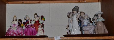Lot 294 - A collection of nine Royal Doulton figures including three balloon sellers, three Coalport...