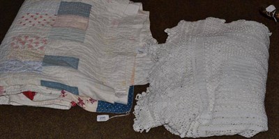 Lot 296 - A Victorian patchwork quilt and a white crochet bed cover decorated with swans