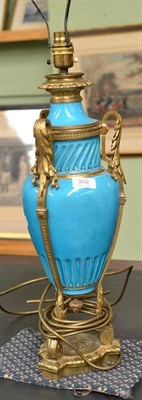 Lot 302 - A Victorian ormolu and turquoise porcelain table lamp converted from oil lamp