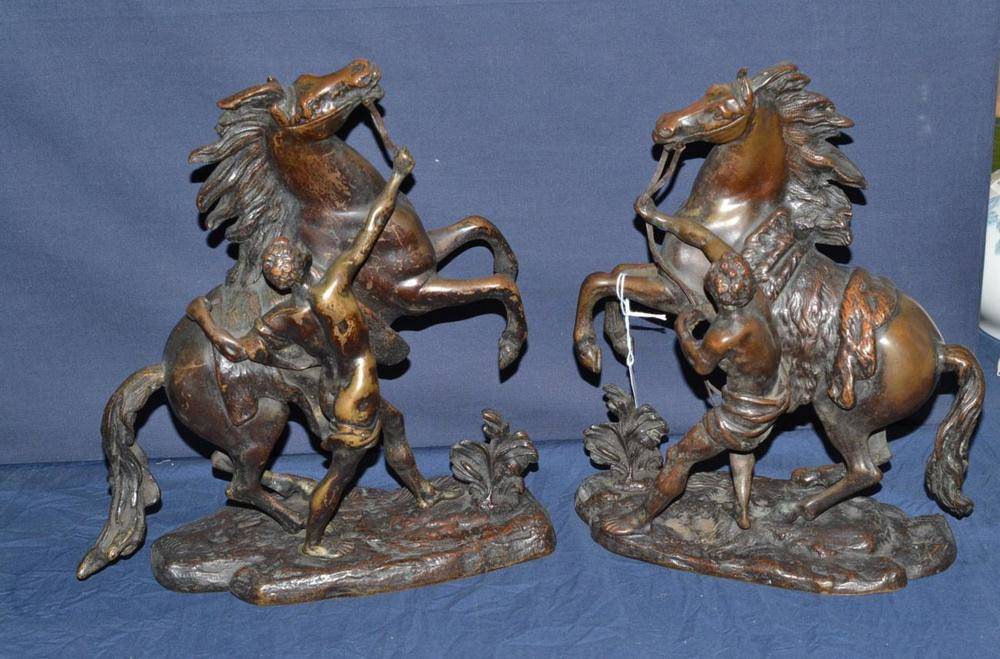 Lot 304 - A pair of bronze Marley horses (one tail a.f.)