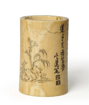 Lot 176 - A Chinese Elephant Tusk Section Small Brush Pot, late Qing Dynasty, incised with a mountainous...