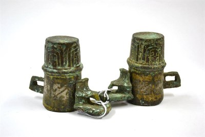 Lot 179 - A Pair of Chinese Bronze Axel Fittings, possibly East Zhou Dynasty, with stiff leaf moulded...