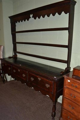 Lot 370 - A late 18th century oak open dresser with a later rack