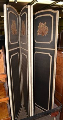 Lot 391 - A fabric mounted four fold screen with machine worked appliques