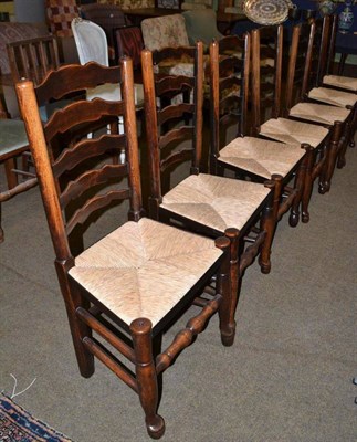 Lot 447 - A composite set of eight ladder back dining chairs with rush seats