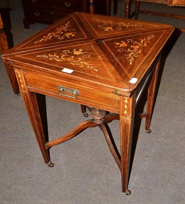 Lot 466 - A 19th century rosewood inlaid envelope games table with single drawer