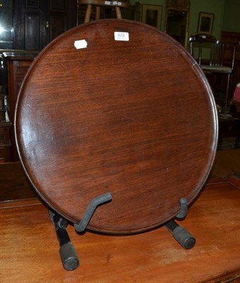 Lot 472 - A round mahogany tray
