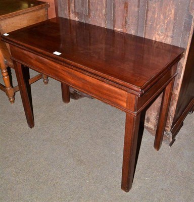 Lot 478 - A George III mahogany fold-over card table