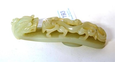 Lot 193 - A Chinese Jade Belt Hook in Archaic Style, probably circa 1900, of slightly arched form with dragon