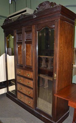 Lot 494 - A large late Victorian carved walnut double wardrobe