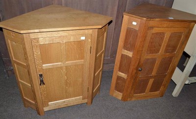Lot 497 - An English hardwood Furniture Fumed English oak panelled floor corner cupboard, by Nigel Dixon,...