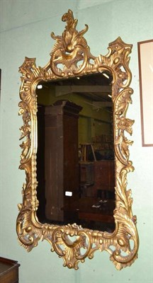 Lot 498 - Painted and carved giltwood wall mirror