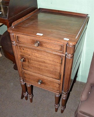 Lot 499 - A George IV mahogany bedside commode with tray top, dummy drawer, cupboard and commode drawer...