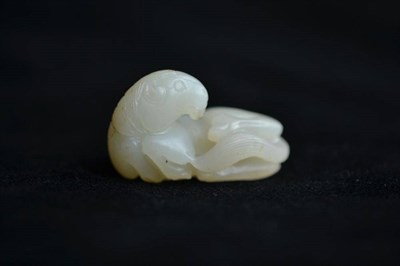 Lot 195 - A Chinese Celadon Jade Carving of a Recumbent Horse, 18th century or earlier, 4cm long