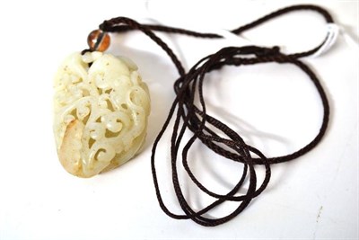 Lot 196 - A Chinese Hollow Carved Jade Type Pendant, late 19th/early 20th century, in tones of white with...