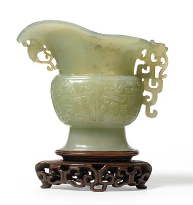 Lot 198 - A Chinese Jade Pouring Vessel, Qing Dynasty, of archaic form with pierced stylised dragon and...