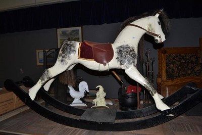 Lot 567 - White painted rocking horse on rocker base