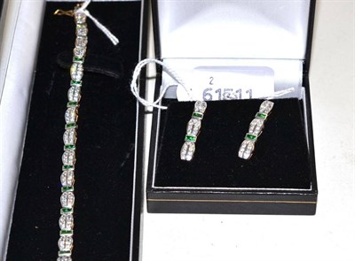 Lot 31 - A 9ct gold bracelet and a pair of matching drop earrings, set with green and white stones