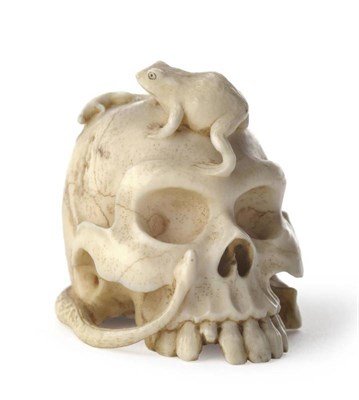 Lot 212 - A Japanese Carved Ivory Netsuke of a Human Skull, late Meiji period (1868-1912), the well...