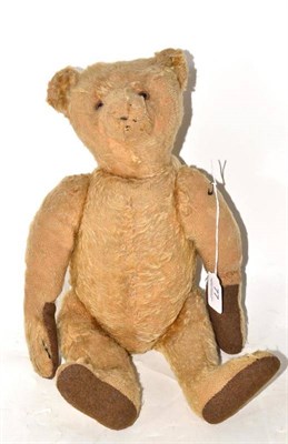 Lot 77 - Early 20th century Steiff yellow mohair jointed teddy bear, with a metal stud to the ear...
