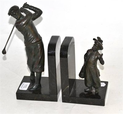 Lot 110 - A pair of Art Deco spelter bookends of a golfer and his caddy boy