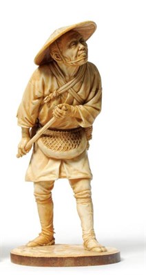 Lot 219 - A Tokyo School Elephant Ivory Okimono as a Fisherman, by Udagawa Kazuo, circa 1910, standing...