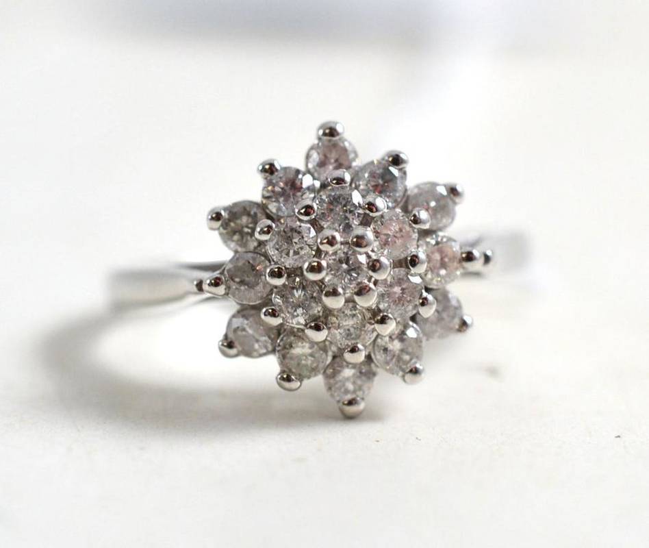 Lot 131 - An 18ct white gold diamond cluster ring