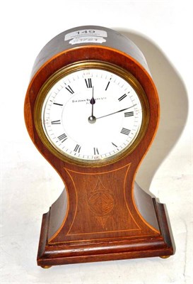 Lot 149 - An Edwardian mahogany cased balloon shaped mantel clock