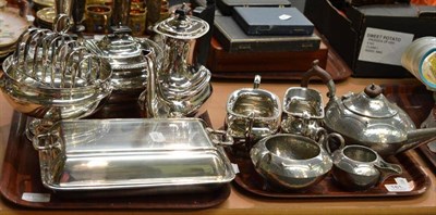 Lot 161 - English pewter three piece tea set, four piece plate set, entree dish, toast rack and footed bowl
