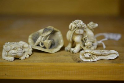 Lot 224 - A Japanese Carved Elephant Ivory Okimono as a Shi-Shi and Cub, late Meiji period (1868-1912),...