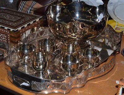 Lot 173 - A large electroplated tray and a punch bowl with six cups and ladle