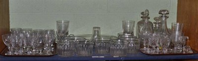Lot 179 - A shelf of cut glass and crystal including nine glass rinsers, decanters etc