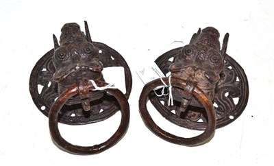 Lot 213 - Two bronze ?Tibetan door rings
