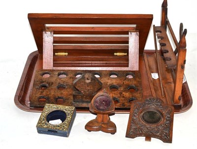 Lot 236 - Three pocket watch holders, gate pipe holder, a spoon rack and a book rest