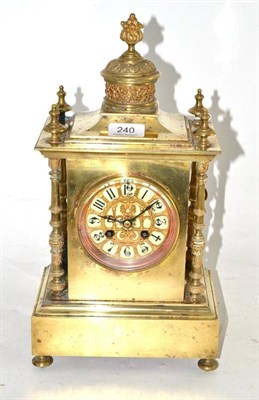 Lot 240 - A brass striking mantel clock