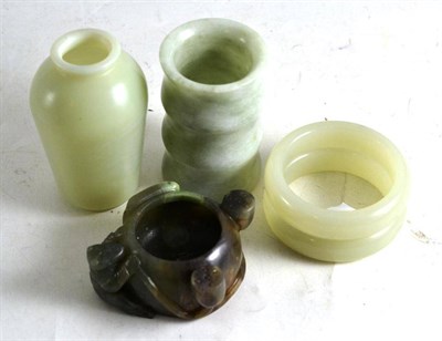 Lot 287 - Two jade-effect vases, two bangles and a lotus shaped brush washer (4)