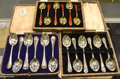 Lot 302 - Cased set of six silver gilt and enamel teaspoons and two cased sets of six silver teaspoons (3)