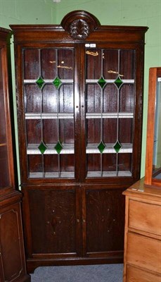 Lot 384 - 1920s/30s oak bookcase with leaded glass doors