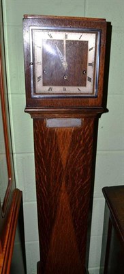 Lot 387 - An oak cased grandmother clock