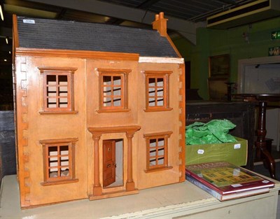 Lot 406 - A Georgian style wooden doll's house, together with a small quantity of furniture and two...